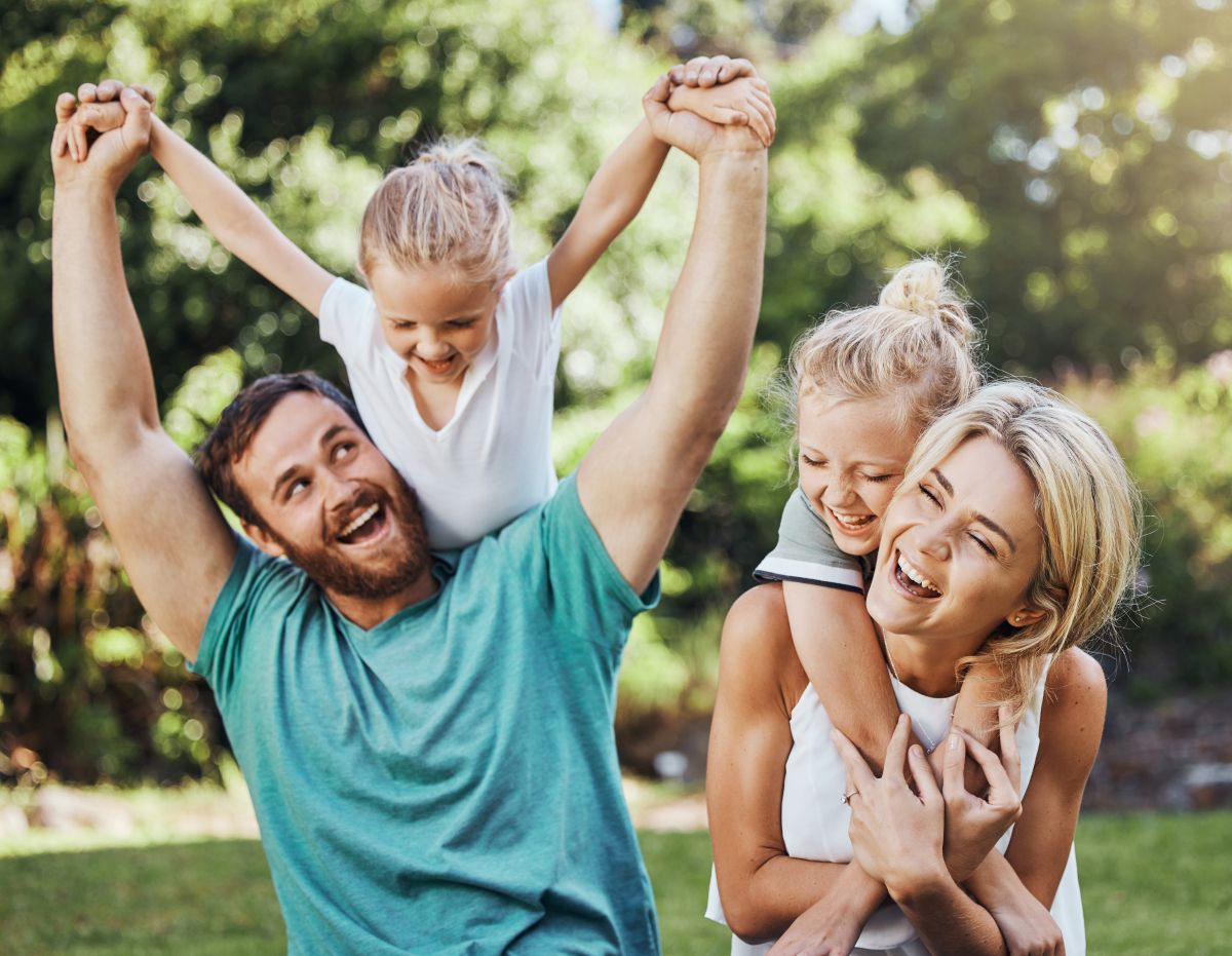 Happy family playing in a park