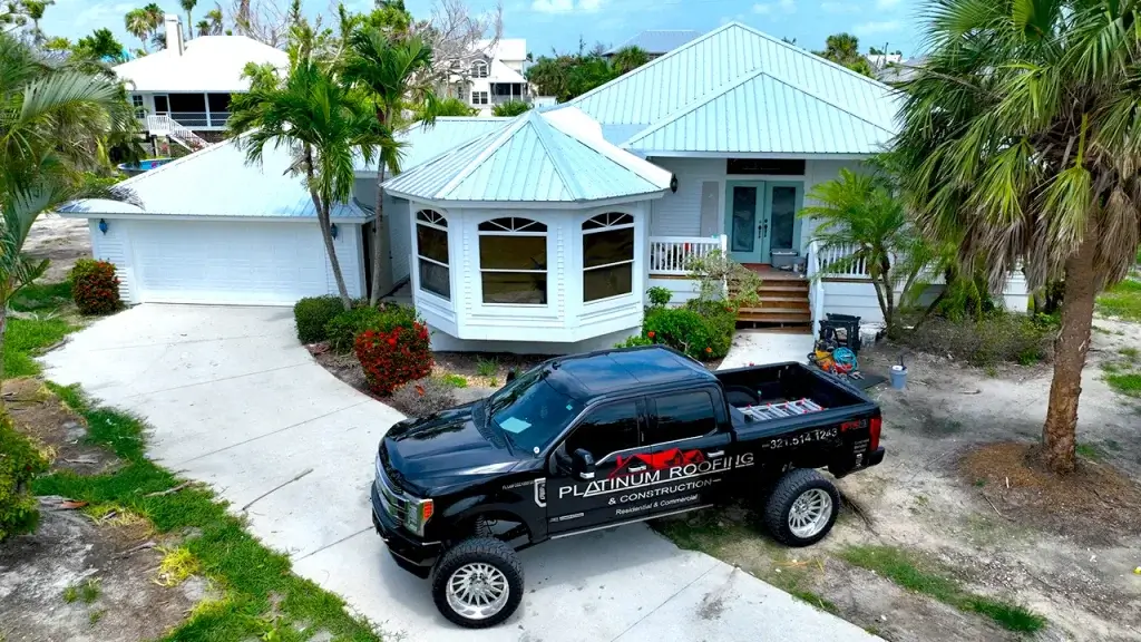 Platinum Roofing van in front of a residential house